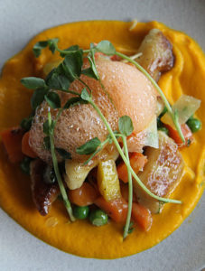 Gnocchi with peas and carrot foam
