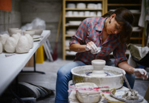 Ceramics artist Amy Halko working in her home studio near Lake Sonoma. (photo by Erik Castro)