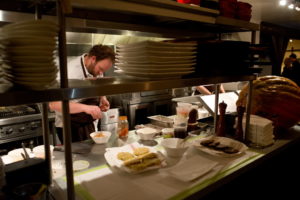 Chef Daniel Kedan prepares an apple compote to accompany yukon gold and purple potato latkes at Backyard restaurant in Forestville, Calif., on November 14, 2013. (Alvin Jornada / The Press Democrat) Hannukah Latkes at Backyard Restaurant