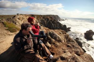Steve and Wanda Ameral, of Sebastopol scan the horizon for migrating whales from Bodega Head. (Christopher Chung/ The Press Democrat)