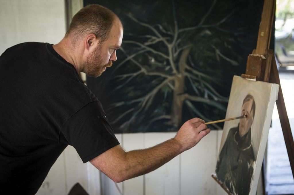 Artist in residence Frank Ryan painting a portrait of Rodger Warnecke at Chalk Hill studio. (photo by Chris Hardy)