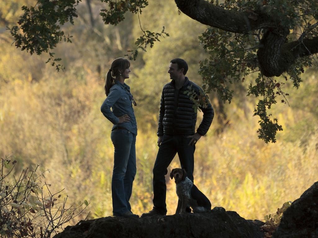 At Warnecke Ranch near Windsor, Alice Warneck Sutro and her husband, Eliot Sutro on a rock overlooking the Russian River on the edge of the property (photo by Chris Hardy)