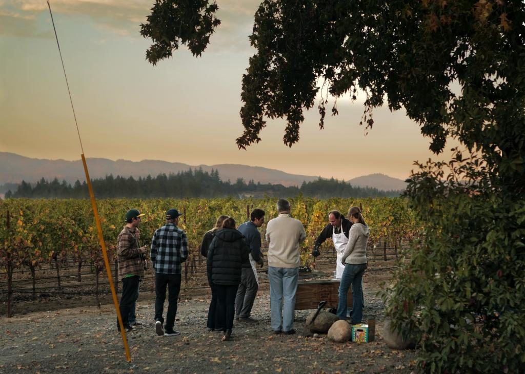 Andy Barker (with apron) lives at the ranch in a 1940's airstream. He is the tasting room manager at Gary Farrell winery. (photo by Chris Hardy)