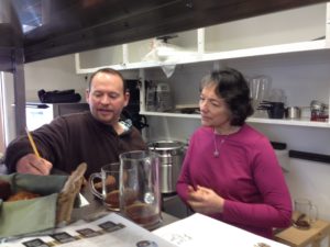 TRILLIUM CHEF JEREMY BAUMGARTNER CONSULTS WITH SUPPORTER MARGARET FOX