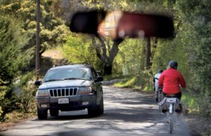 Cyclists and vehicles maneuver for room on narrow West Dry Creek Road. (photos by John Burgess)