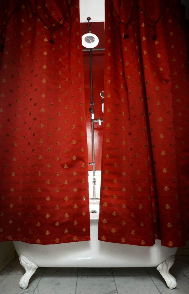 The clawfoot tub with shower in the 1880s cottage at Garden Valley Ranch in Petaluma. (Erik Castro/for Sonoma Magazine)