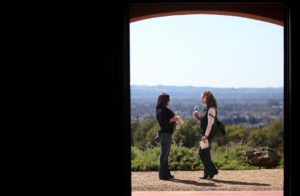 Marissa Montenegro, left, and Tamra Pinoris enjoy the view at Paradise Ridge Winery, in Santa Rosa, during the Wine Road Barrel Tasting in 2012. (photo by Christopher Chung)