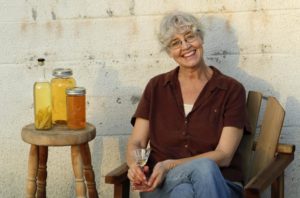 Laura Hagar Rush enjoys one of her signature aperitifs outside the old Denman Creamery at Sonoma Aperitif in Penngrove. (Photos by Connor Jay / PathosPhoto)