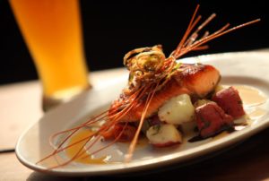 Irish lox topped salmon over red potatoes, leek fondue, and ale butter, by Hopmonk Tavern executive chef Billy Reid, served with Hopmonk Dunkelweizen. (photos by Christopher Chung)