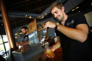 Fraser Ross pours a beer for the Friday crowd at Fogbelt Brewing Company. (Conner Jay)