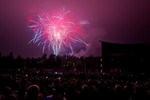 Fireworks illuminate hundreds of guests seated on the lawn behind Weill Hall to view the 4th of July Fireworks Spectacular at the Sonoma State University's Green Music Center in Rohnert Park, California on July 4, 2014. (photo by Alvin Jornada)