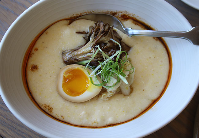 Grits with preserved egg, hen of the woods mushrroms, schmaltz at Bird and The Bottle, a new Stark Reality Restaurant in Santa Rosa, CA