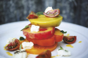 From cherry varieties paired with panna cotta and a late-harvest Chardonnay to heirloom beauties featured in a stacked salad, tomatoes have a role in dishes ranging from appetizers to dessert. (Photo by Chris Hardy)