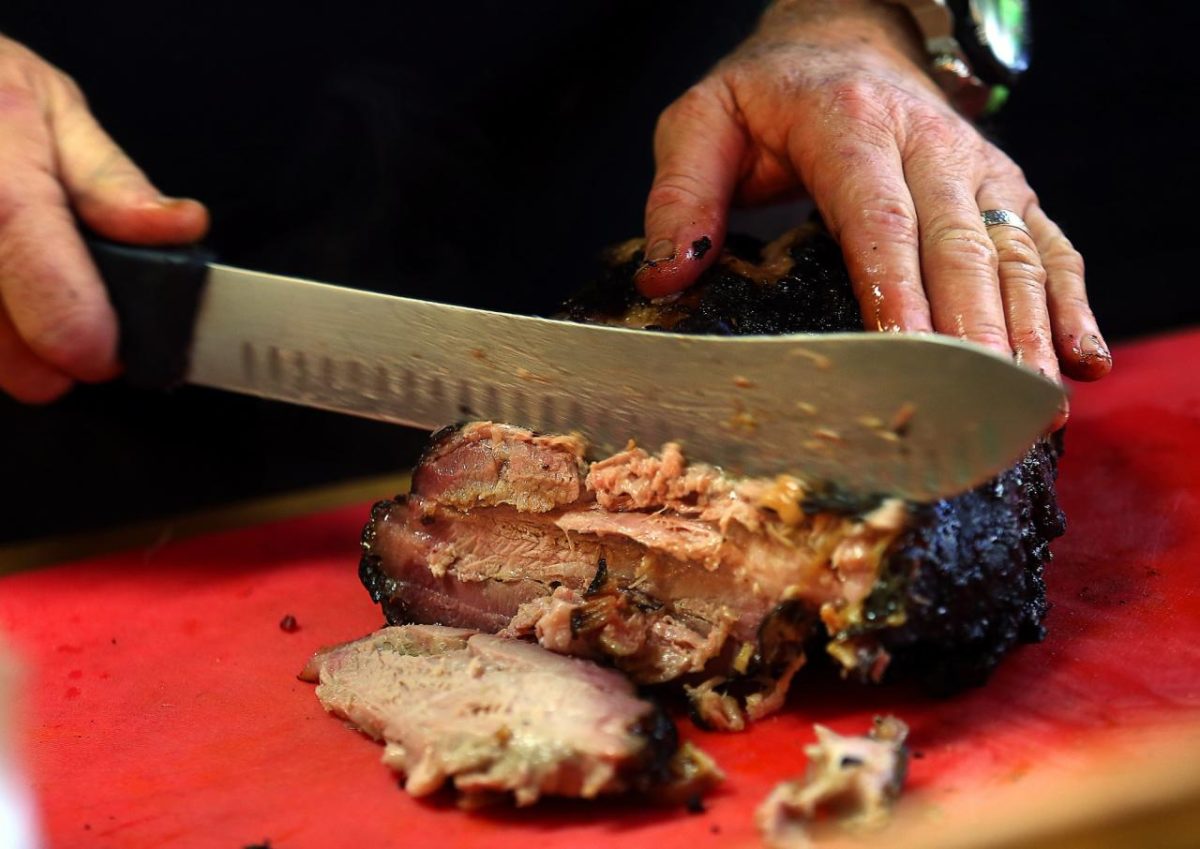 Slicing beef brisket at the Cochon Volant BBQ Smoke House in Sonoma. (John Burgess / The Press Democrat) 