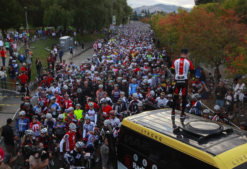 Levi Leipheimer of Santa Rosa prepares to talk to over 7500 bicycle riders at the start of his King Ridge Gran Fondo. (Kent Porter / Press Democrat) 