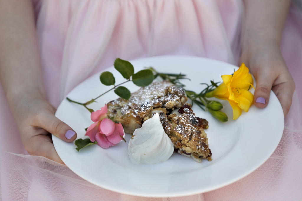 Fiona Grimm, 7, holds an apple cranberry crostata with a cinnamon topping and creme anglaise during a spring brunch class at Ramekins on Sunday, April 17, 2016 in Sonoma, California . (BETH SCHLANKER/ The Press Democrat)