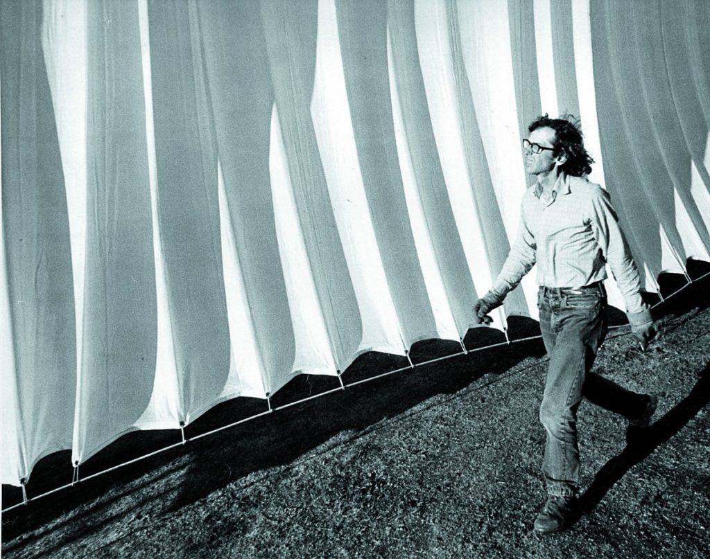 Christo walks along a section of his "Running Fence" in Sonoma County. (Photo by Wolfgang Volz)