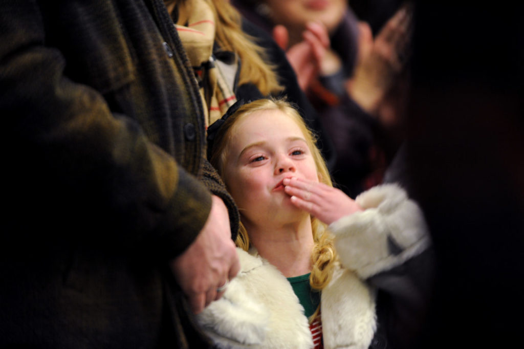 Scarlett Lemieux, 6, of Petaluma, California blowing kisses to Snoopy during the Snoopy ice show and holiday tree-lighting event held Friday evening at the Redwood Empire Ice Arena in Santa Rosa. December 2, 2011 (Photo: Erik Castro/for The Press Democrat)
