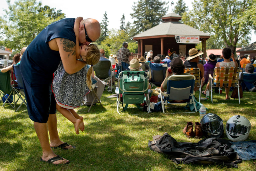 6/14/2014:B2: Christopher Cooney of Cotati gives daughter Jossilyn, 3, a kiss on the cheek during the Cotati Jazz Festival on Sunday. PC: Christopher Cooney of Cotati picks up his daughter Jossilyn, 3, to give her a kiss on the cheek during the Cotati Jazz Festival in Cotati, California, on June 15, 2014. (Alvin Jornada / For The Press Democrat)