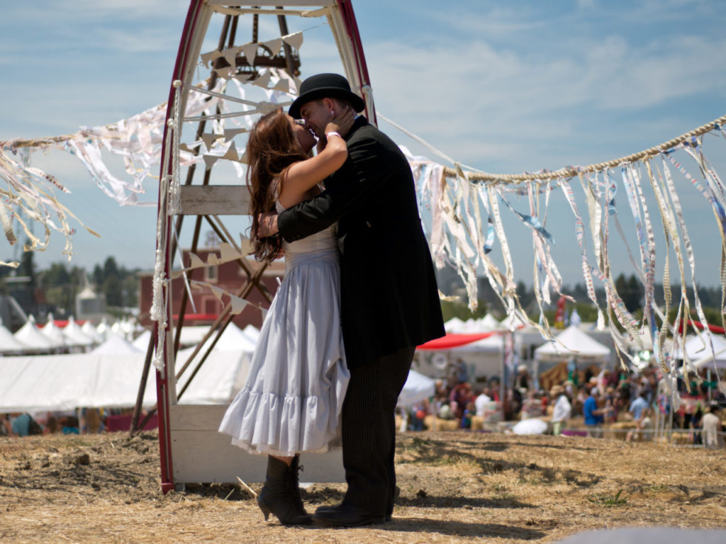 7/20/2014:B1: Newlyweds Jade and Michael Solis kiss after getting married at the Rivertown Revival in Petaluma on Saturday. PC: Newlyweds Jade and Michael Solis kiss after getting married at the Rivertown Revival in Petaluma, California, on July 19, 2014. (Alvin Jornada / For The Press Democrat)