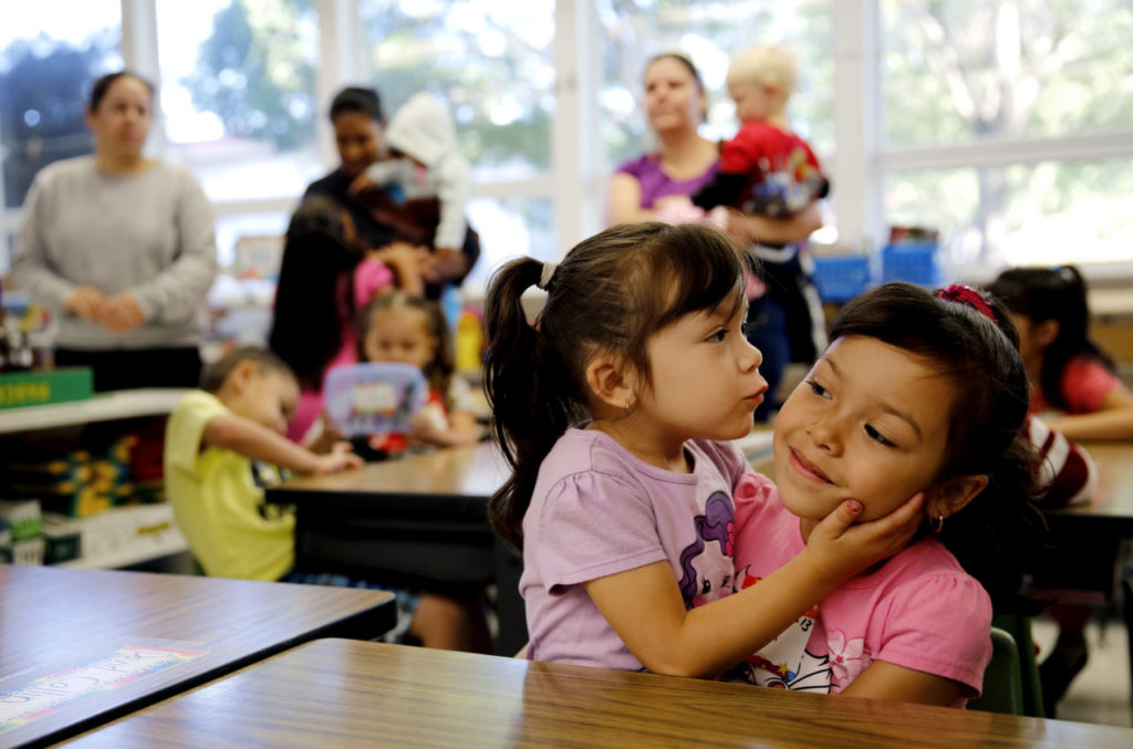 8/18/2013 T1: PC: Kindergartener Diana Perez, 5, right, gets a kiss goodbye from her little sister Michelle, 3, before the first day of classes at Geyserville Elementary School in Geyserville, California on Wednesday, August 14, 2013. (BETH SCHLANKER/ The Press Democrat)
