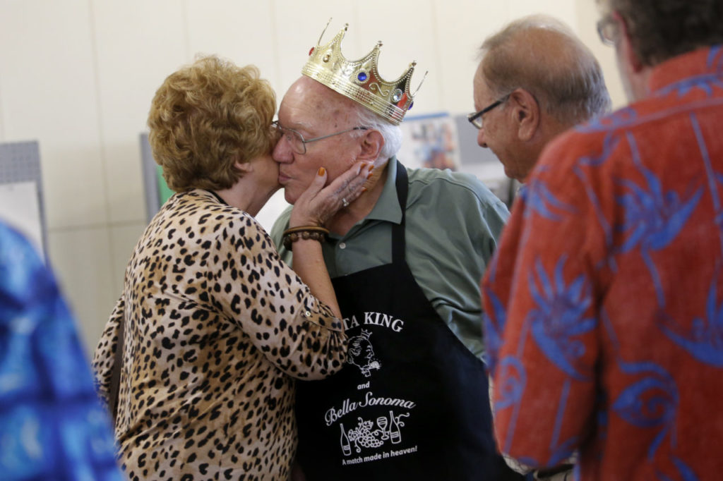 Art Ibleto gets a kiss from Thera Buttaro during his 90th birthday party at Saralee and Richard's Barn at the Sonoma County Fairgrounds on Sunday, October 9, 2016 in Santa Rosa, California . (BETH SCHLANKER/ The Press Democrat)