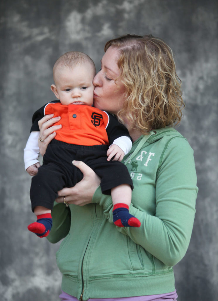 1/29/2011: C3: PC: Sarah Bussell kisses Maddox Liam Bussell "MLB" who was born on the fifth game of the World Series. Bussell went to see the San Francisco Giants' World Series trophy at Santa Rosa City Hall, Jan. 28, 2011.
