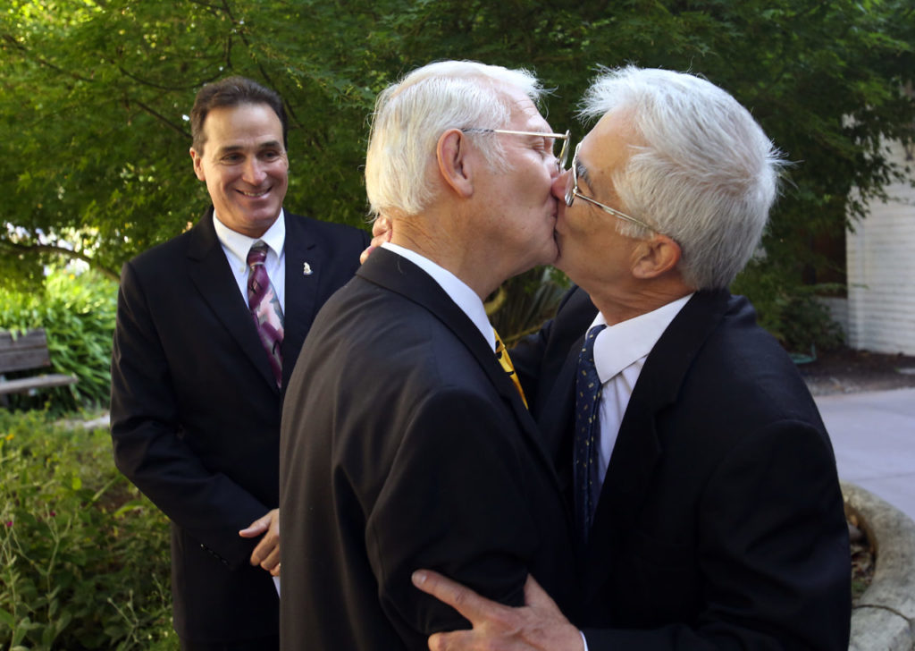 Ed Mason, left, of Larkfield, kisses his partner of 46 years, Barry Hong, after Sonoma County Clerk Bill Rousseau completed their marriage ceremony in Santa Rosa on July 1, 2013. (photo by John Burgess/The Press Democrat)