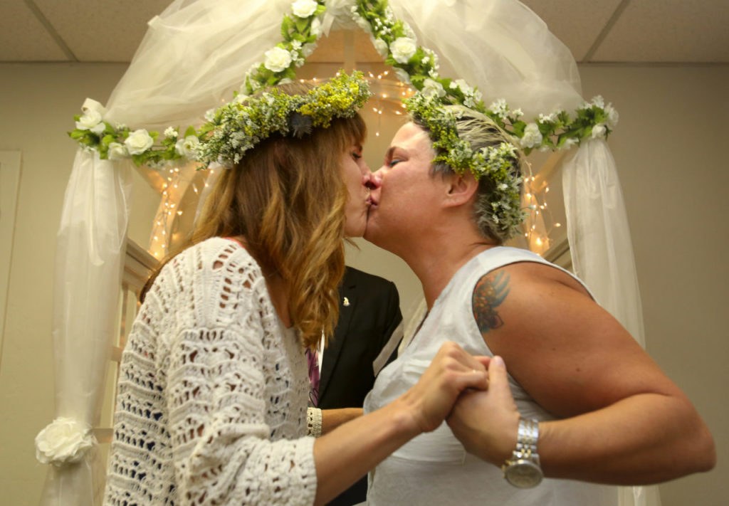 Amy Evans-Reber, left, kisses her new bride, Emily Evans-Reber after their ceremony at the office of the Sonoma County Clerk in Santa Rosa on Monday, July 1, 2013. (photo by John Burgess/The Press Democrat)