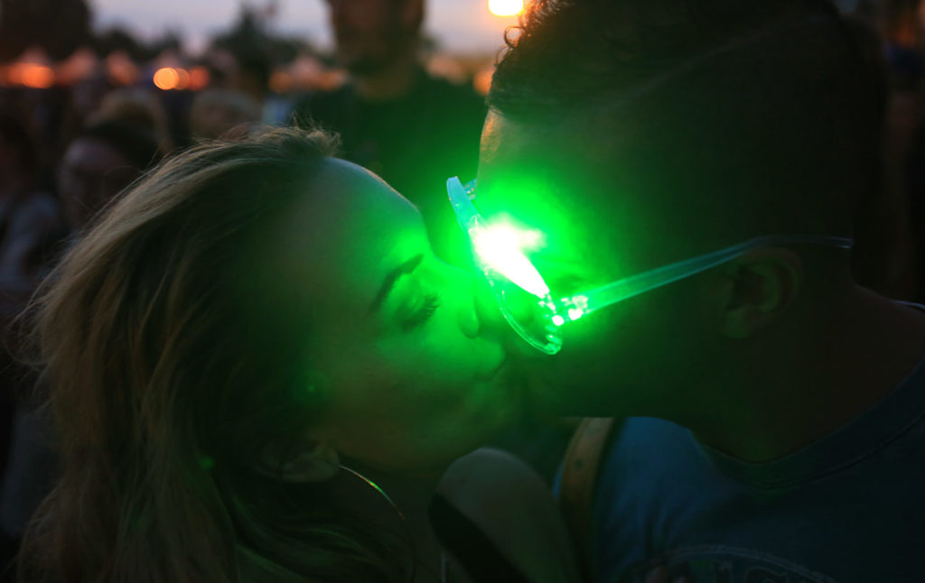 A Sacramento couple smooch during the Stevie Wonder set during the first day of BottleRock Napa, Friday May 27, 2016. (Kent Porter / Press Democrat) 2016