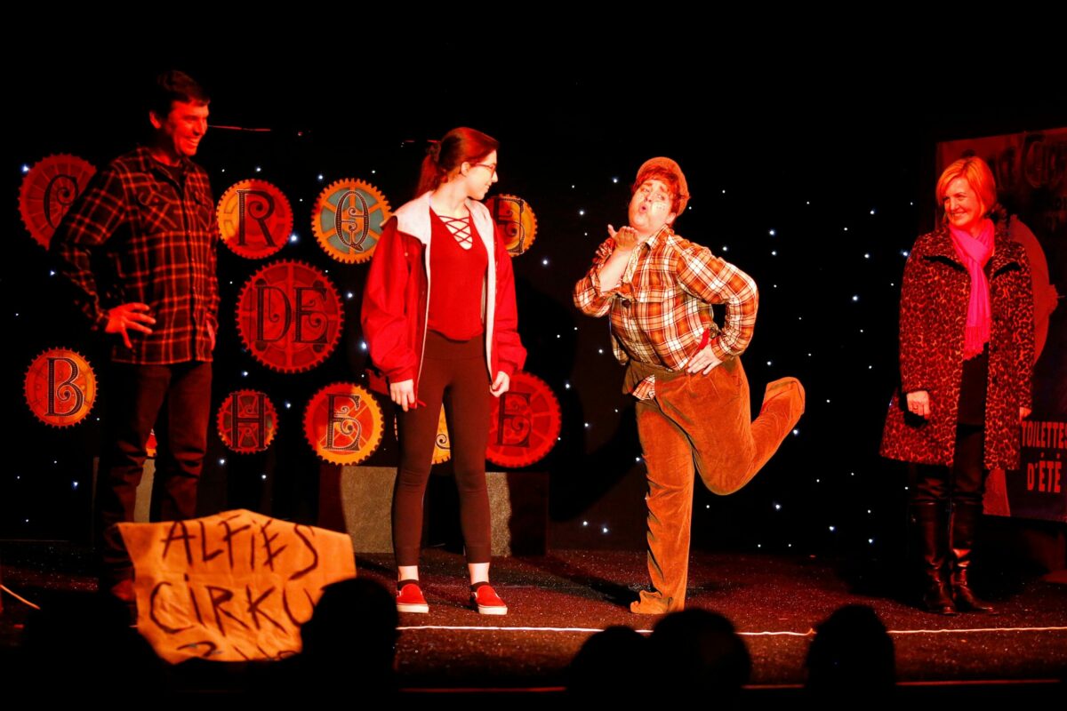 Alfie the Clown, played by Amelia Van Brunt, instructs audience members Marc Worona, left, Lauren Worona, 17, and Jennifer Powers, right, a pantomime skit they will perform on stage during Le Cirque de Boheme at Cornerstone Sonoma, in Sonoma. (Alvin Jornada / The Press Democrat)