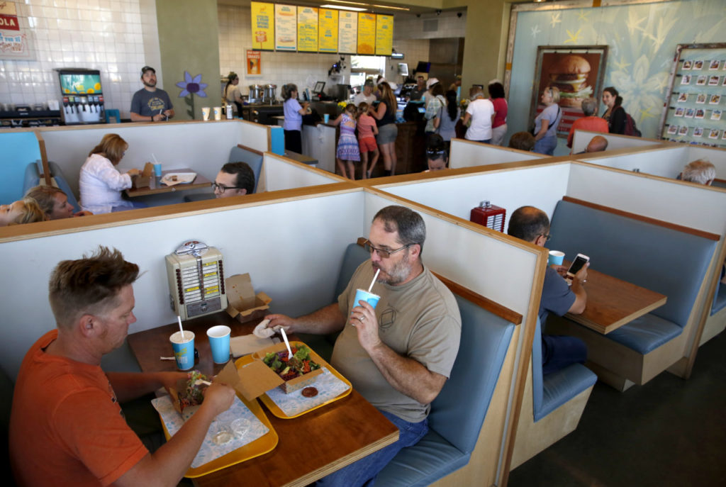 Coworkers Steve Arlich and Karl Strong eat lunch at Amy's Drive Thru on Wednesday, June 29, 2016 in Rohnert Park, California . (BETH SCHLANKER/ The Press Democrat)
