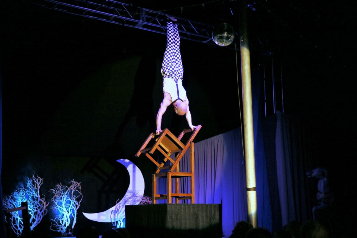 Jeramy Vik balances on chairs during the Cirque de Boheme performance of 'Yesterday' at Cornerstone in Sonoma. (Will Bucquoy/For The Press Democrat) 
