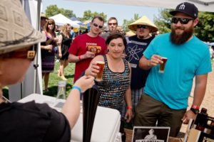 Amy Levin pours St. Florian beer at Beerfest.