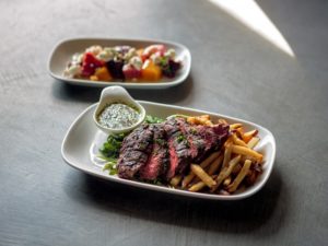 Beets with goat cheese and hazel nuts, and steak frites at Boon Eat + Drink in Guerneville. (Chris Hardy/Sonoma Magazine)