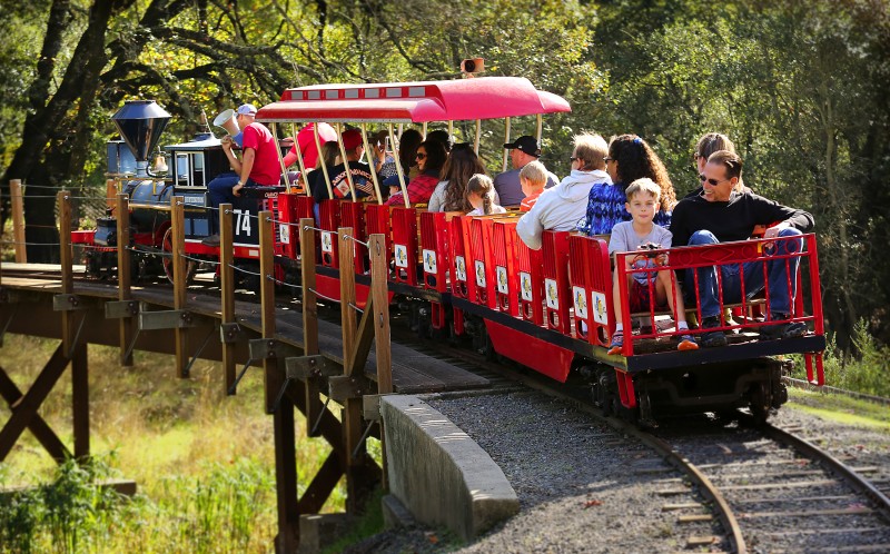 Passengers ride on a simulated 1863 C.P. Huntington steam train at Howarth Park in Santa Rosa, California on Sunday, September 29, 2013. (BETH SCHLANKER/