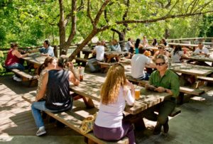 Guests enjoying cold drinks on the patio overlooking the Russian River at Stumptown Brewery in Guerneville. (Alvin Jornada)