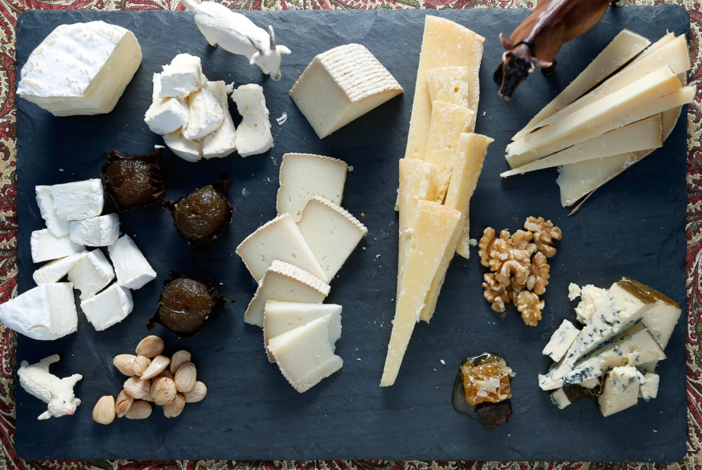 A cheese plate assembled by cheese monger Omar Mueller featuring (clockwise from lower left) Marcona Almonds, Pennyroyal Farm Bollie's Mollies, Amexia D'Elvas Convento de Serra natural preserved plums, Cowgirl Creamery Mt. Tam triple-cream, Bleating Heart Cheese Fat Bottom Girl, Valley Ford Cheese Estero Gold Reserve, Point Reyes Cheese Company Gouda, aged two years, raw local walnuts, Rogue Creamery Rogue River blue cheese, and Regalis Tennessee black truffle honeycomb, at Freestone Artisan Cheese, in Freestone, California on Tuesday, November 29, 2016. (Alvin Jornada 