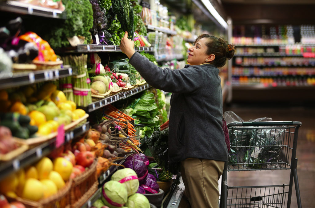 Mirabel Garcia shops for produce at Big John's Market in Healdsburg on Wednesday, February 22, 2017. (Christopher Chung/ The Press Democrat)