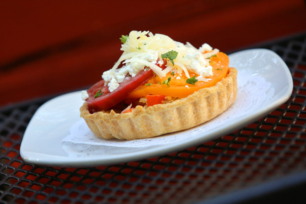 9/12/2012: D1: PC: Tarte Rustique by Chloe's French Cafe-Catering features pate brisee base, sweet gypsy pepper, red pepper & garlic piperade, mixed heirloom slices, goat cheese crumble & Mezzo Secco cheese, served with salad verte.