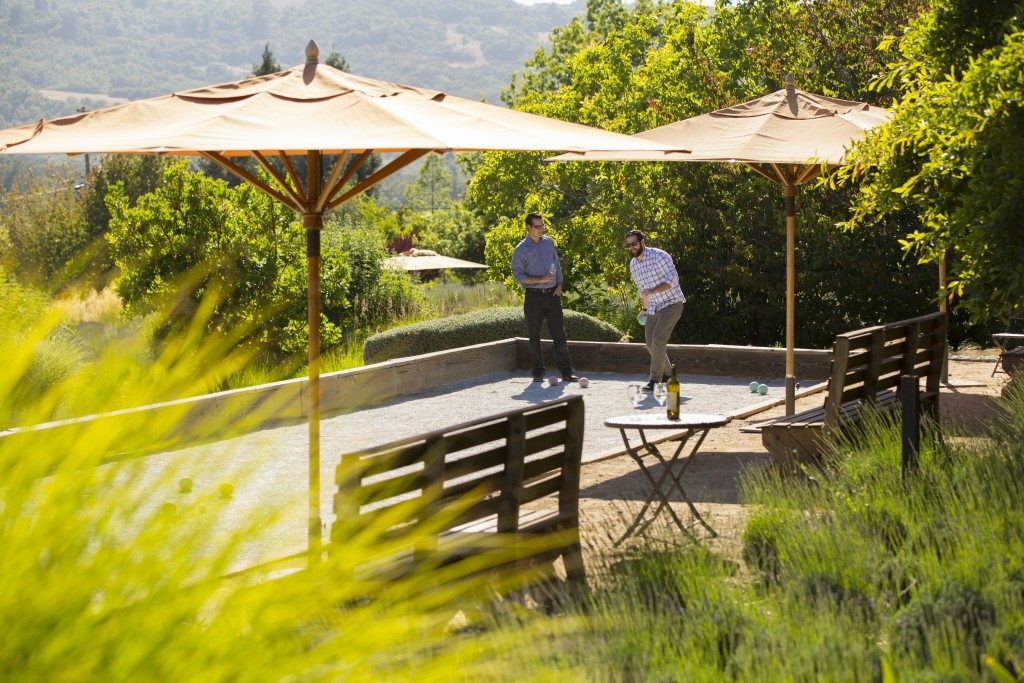 Two men play bocce ball at Mantanzas Creek Winery in Santa Rosa, California