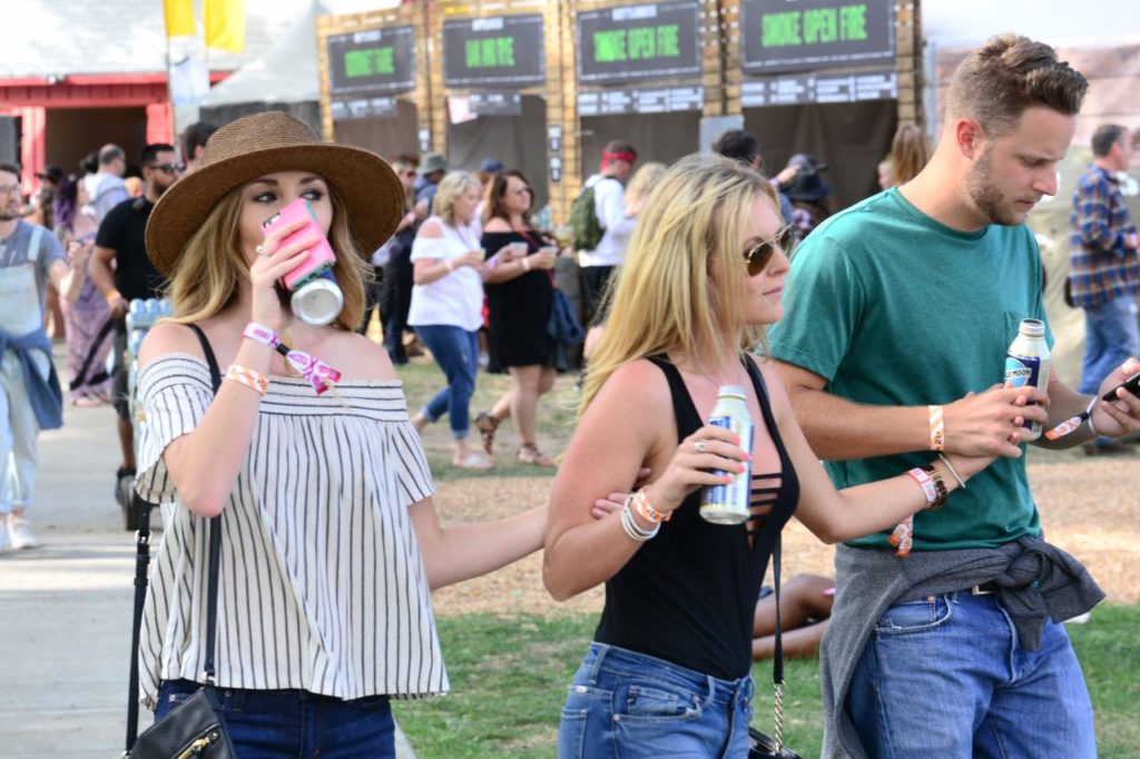 Beer drinkers enjoyed a cold one in the sun between acts. (Tim Vallery) 