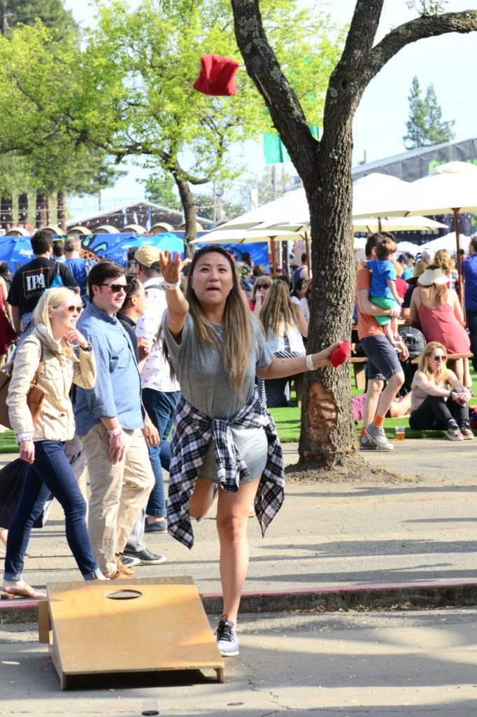 Craft beer lovers and music fans took a break from the crowds and enjoyed a game of cornhole. (Tim Vallery)