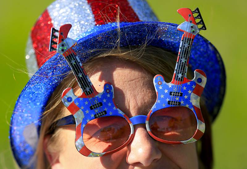 Mishelle Harris of Santa Rosa gets in the celebratory spirit for the 2013 Red White and Boom fireworks show at the Sonoma County Fairgrounds.