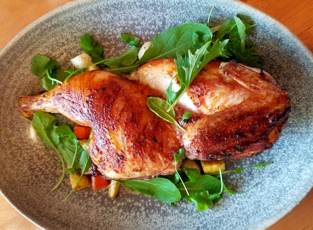 Half roasted chicken with root vegetables at Trading Post Restaurant in Cloverdale. heather irwin/PD