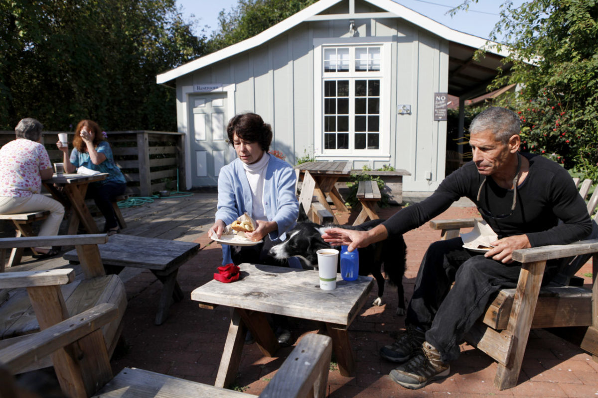 Hal Lemberger, his wife Diana, and their dog, Amy, sit on the back patio and have breakfast at Gold Coast Coffee and Bakery in Duncans Mills on Tuesday, September 13, 2011. (Beth Schlanker / The Press Democrat)
