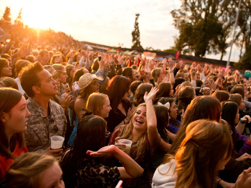 Concert-goers high-five each other as award-winning singer/songwriter Hunter Hayes performs live at Chris Beck Arena during the Sonoma County Fair in Santa Rosa, Calif., on August 6, 2013. (Alvin Jornada / For The Press Democrat)