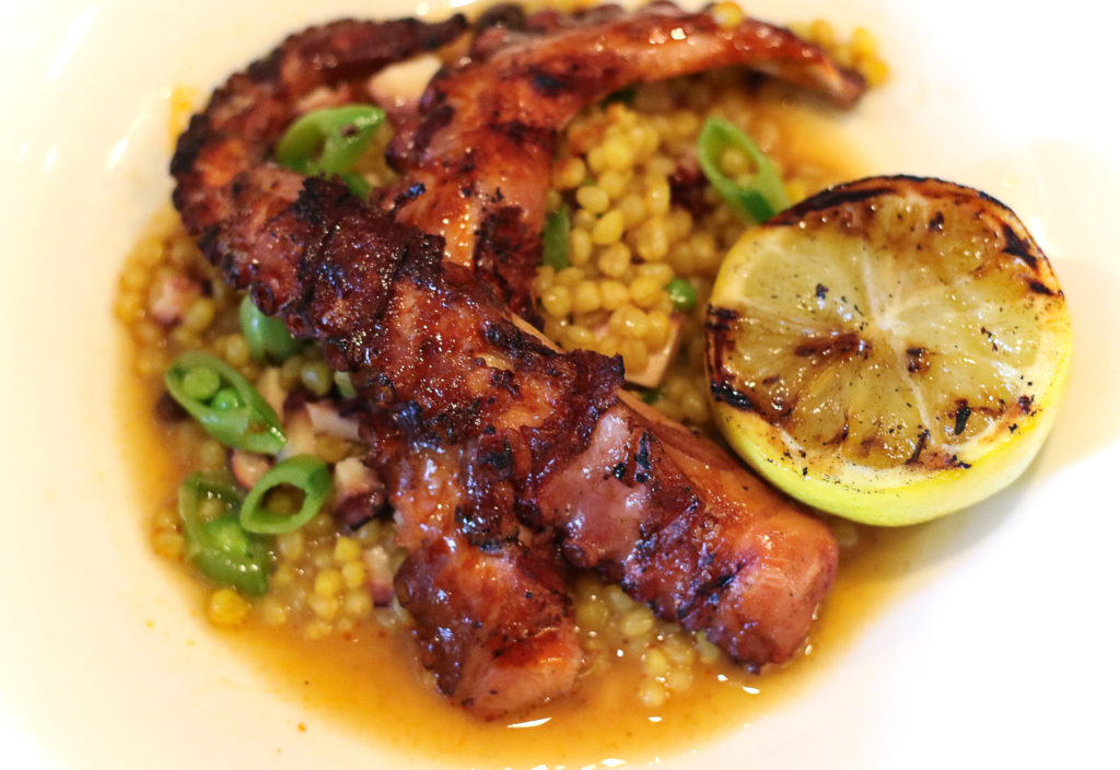 Spanish octopus with wheat berry, black shallot, smoked paprika, snap pea, grilled lemon, bacon broth at the Brass Rabbit in Healdsburg. Heather Irwin/PD