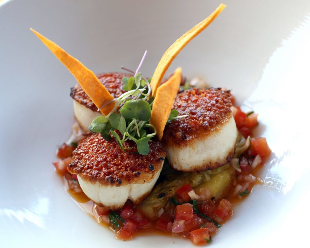 Chourico Crusted Day Boat Scallops from La Salette in Sonoma. Inspired Portuguese inspired scallops with sausage, Japanese sweet potato puree, leek confit, and chimichurri sauce. 452 1st St E, Sonoma CA, 707-938-1927 lasalette-restaurant.com (Crista Jeremiason)
