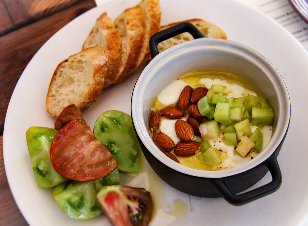 Warm burrata with heirloom tomato, sauce vierge and bread at Russian River Vineyards in Forestveille. Heather Irwin/PD